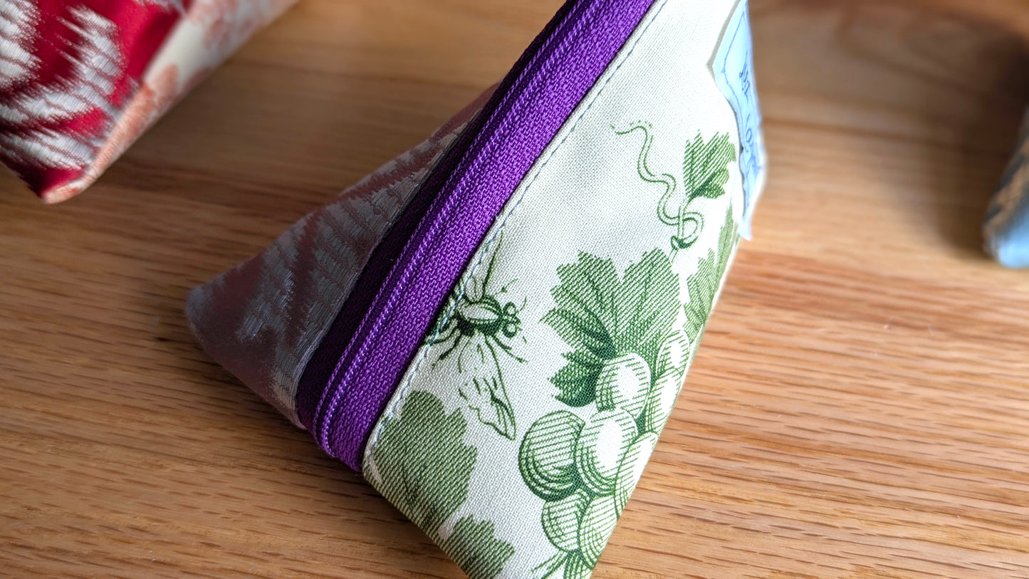 Upcycle upholstery triangle coin pouches