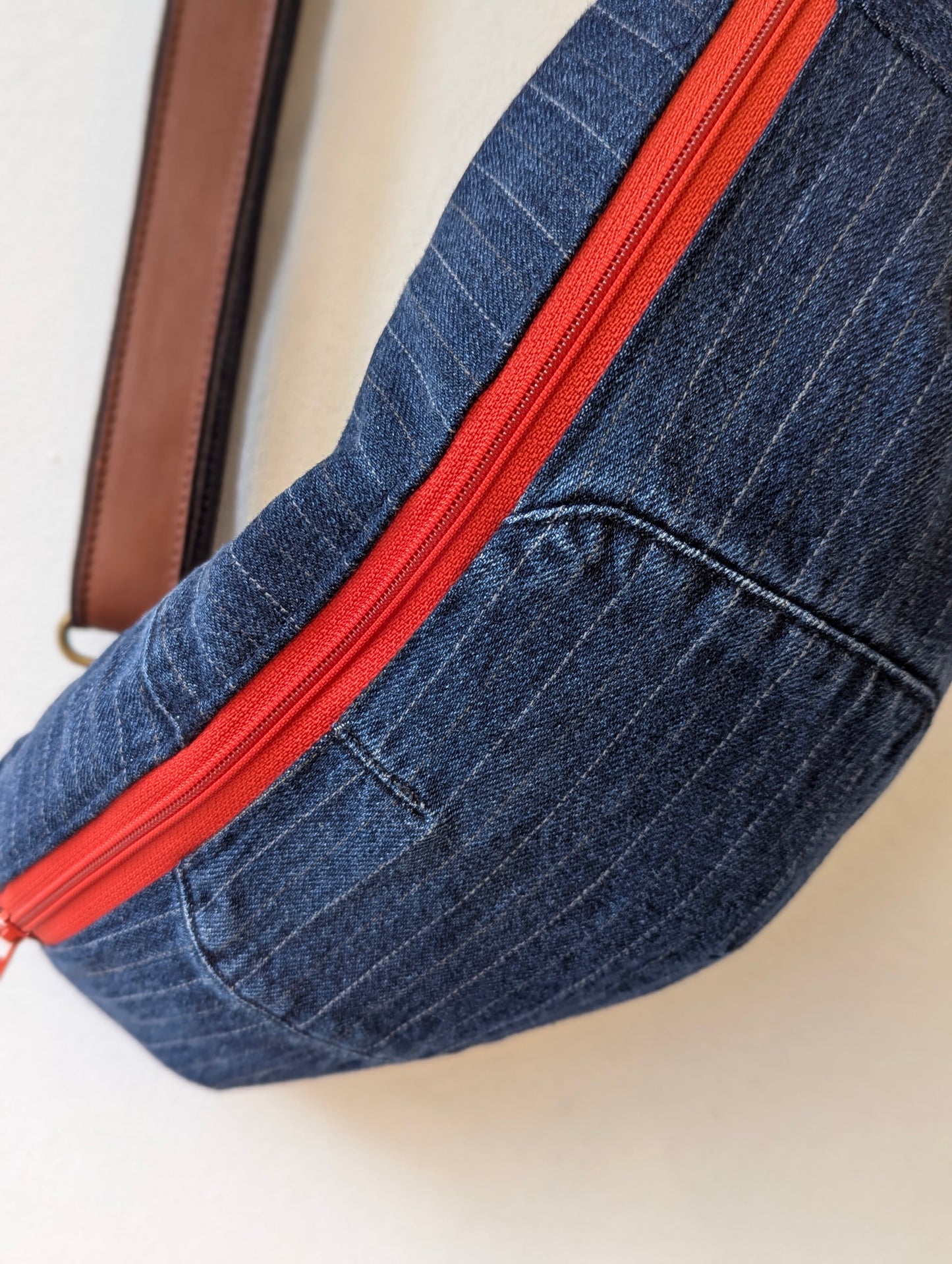 Denim Pinstripe Sling Bag with Red Zipper