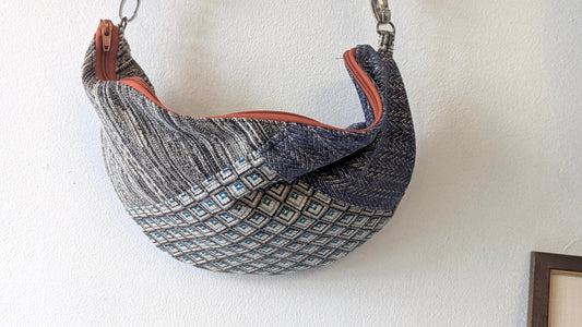 Patchwork upcycle textiles made the half moon bag