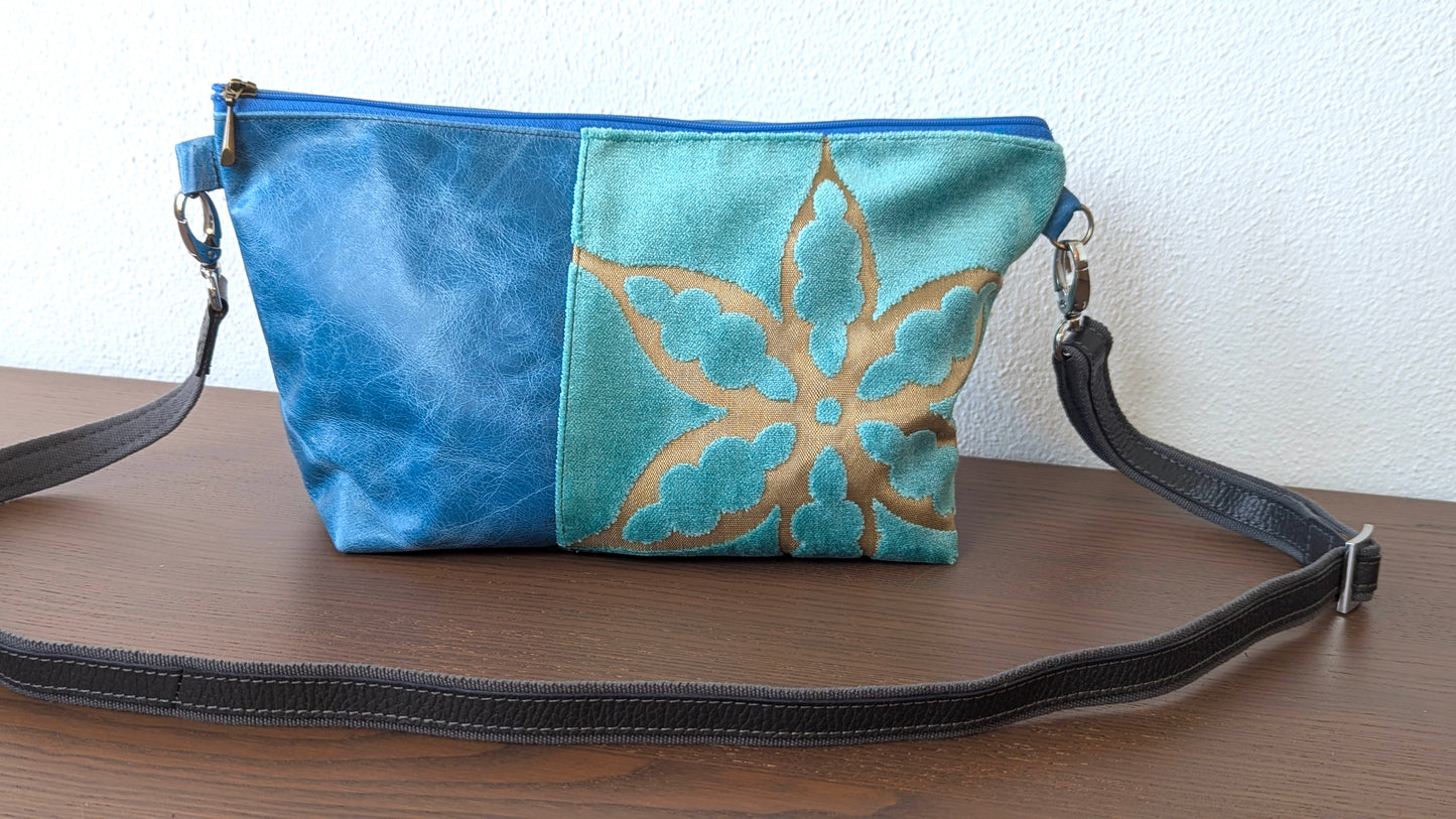 Upcycle textile in baby blue and blue leather bag