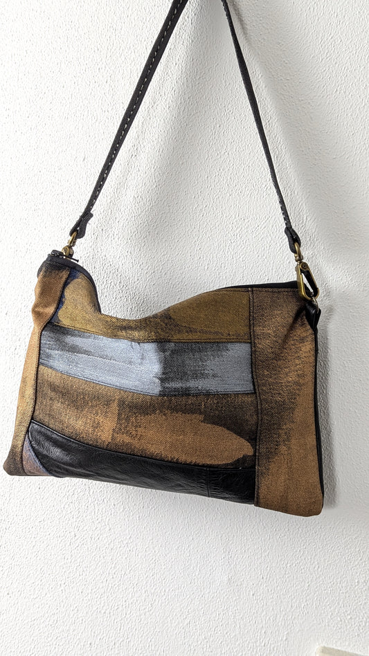 Painted denim and leather bag