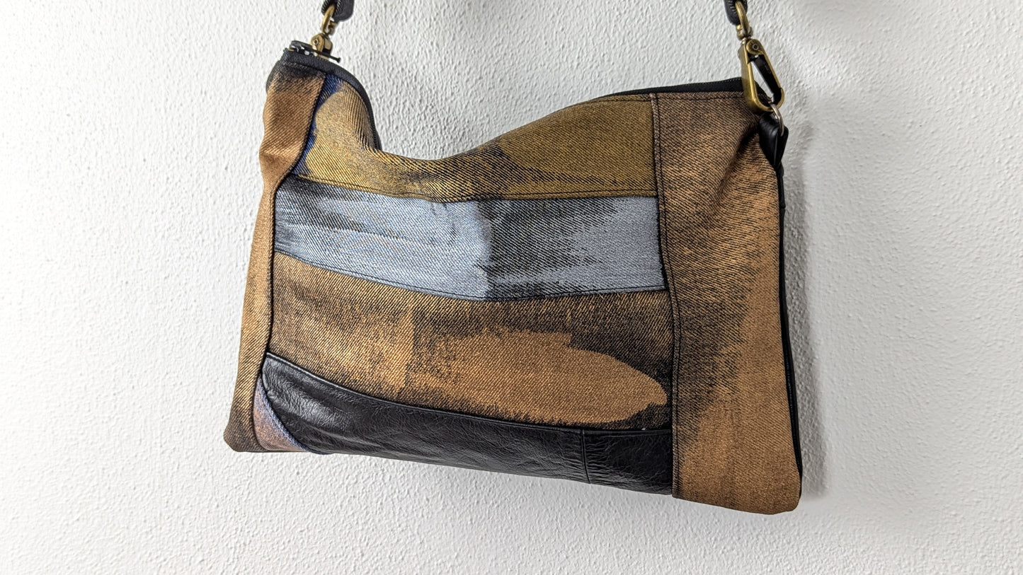Painted denim and leather bag
